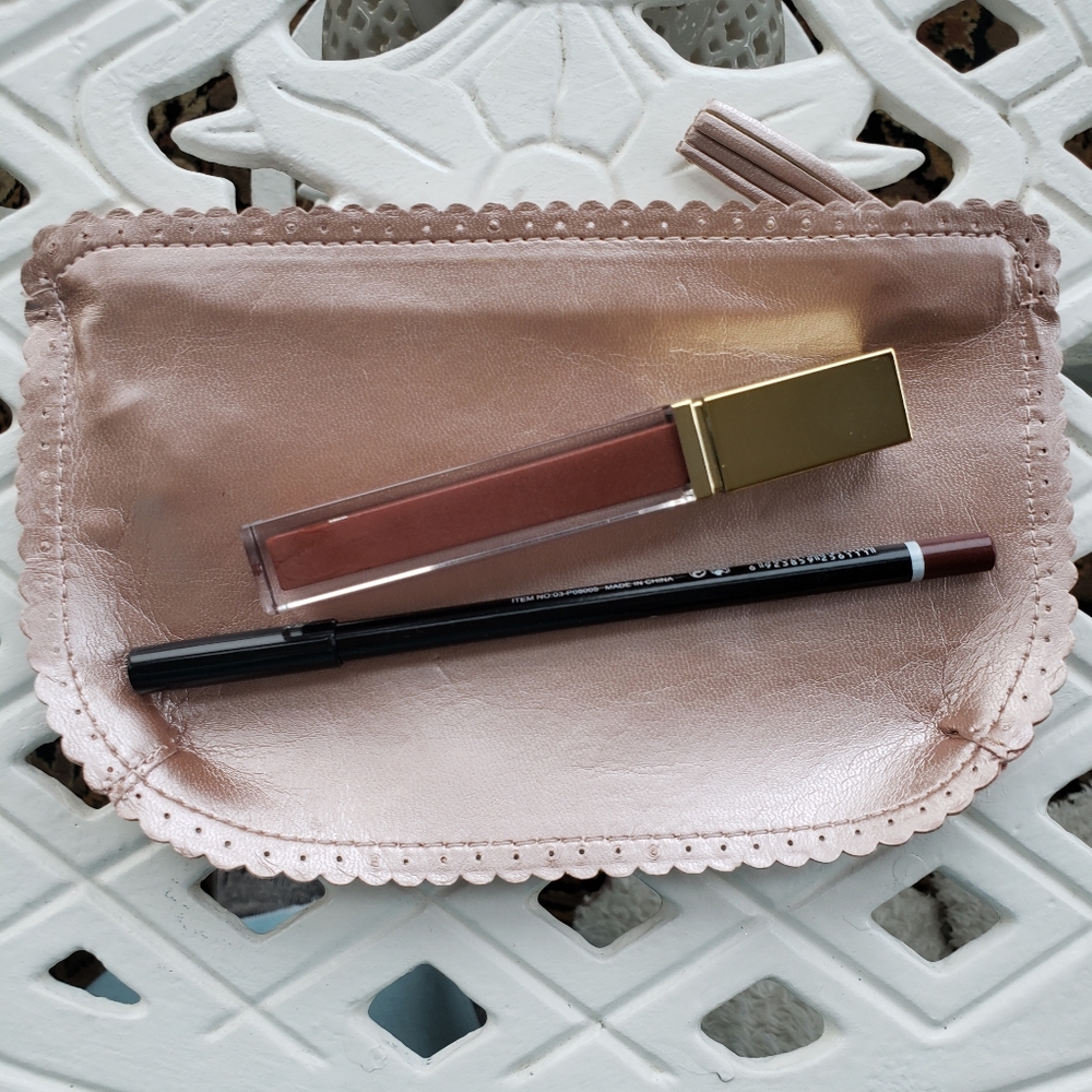 2/$39. Lipgloss, lip liner and carrying case.